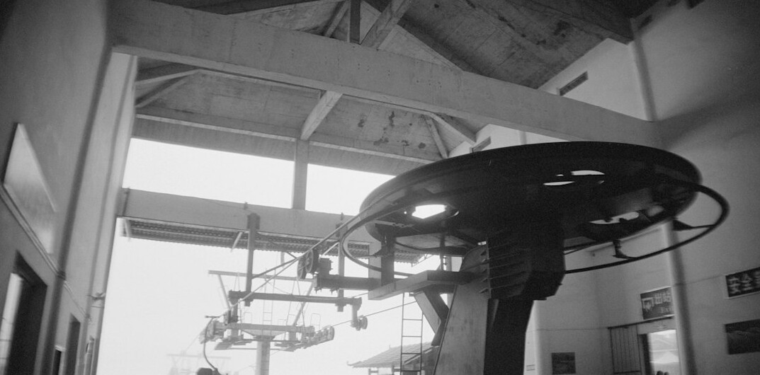 Television news studio with pedestal cameras and lighting rig